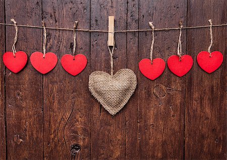 simsearch:400-08034173,k - Love concept. Hearts hanging on a string, shot on wooden background Stockbilder - Microstock & Abonnement, Bildnummer: 400-08431521