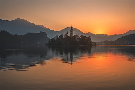 simsearch:400-08317924,k - Little Island with Catholic Church in Bled Lake, Slovenia at Beautiful Colorful Sunrise with Castle and Mountains in Background Stock Photo - Budget Royalty-Free & Subscription, Code: 400-08431899