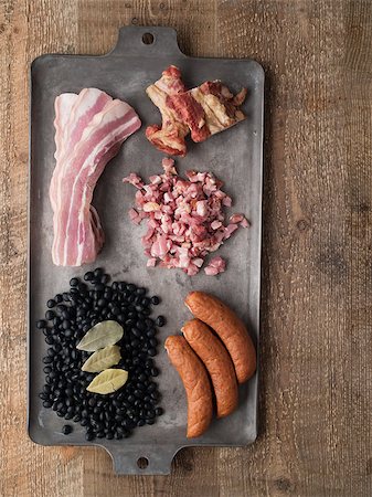 close up of rustic brazilian feijoada pork and black bean stew ingredient Photographie de stock - Aubaine LD & Abonnement, Code: 400-08431928