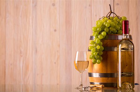 simsearch:400-08110621,k - Bottle of wine with glass a barrel and grapes and light background Stock Photo - Budget Royalty-Free & Subscription, Code: 400-08432019