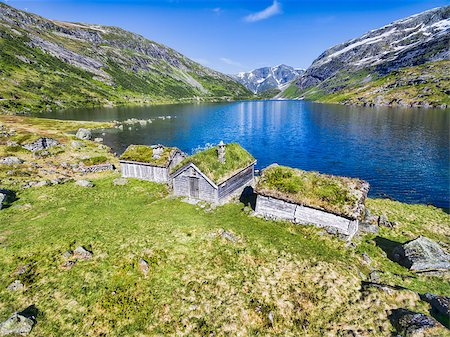 Traditional norwegian huts by picturesque lake surrounded by mountains in Gaularfjellet mountain pass in Norway Stock Photo - Budget Royalty-Free & Subscription, Code: 400-08432147