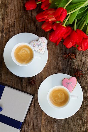 Two cups of Valentines day coffee with fresh red  tulips and gift box  on wooden table, top view Stock Photo - Budget Royalty-Free & Subscription, Code: 400-08432293
