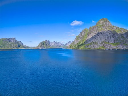 simsearch:400-08428494,k - Scenic low aerial view of fjord on Lofoten islands surrounded by magnificent peaks Stockbilder - Microstock & Abonnement, Bildnummer: 400-08432609