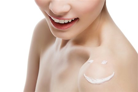 svetography (artist) - Closeup of cream smiley face on young woman shoulder. Isolated over white background. Foto de stock - Royalty-Free Super Valor e Assinatura, Número: 400-08432984