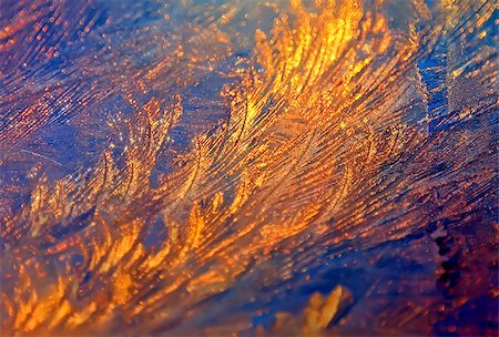 Sparkling ice-rich frosty pattern of thin ice on the window at sunset. Stock Photo - Budget Royalty-Free & Subscription, Code: 400-08494501