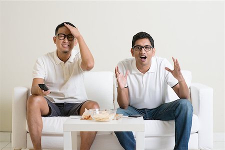 Friendship, sports and entertainment concept. Male friends watching sports together on tv at home. Stock Photo - Budget Royalty-Free & Subscription, Code: 400-08494560