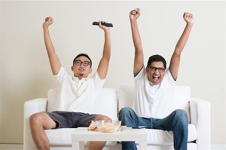 Friendship, technology and home concept. Happy male friends with remote control and junk food at home. Stock Photo - Budget Royalty-Free & Subscription, Code: 400-08494562