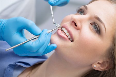 Girl with beautiful white teeth on reception at the doctor dentist. Stock Photo - Budget Royalty-Free & Subscription, Code: 400-08495302