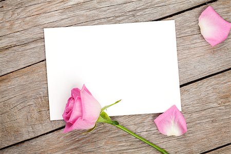 simsearch:400-08110734,k - Valentines day greeting card or photo frame and pink rose over wooden table. Top view with copy space Stock Photo - Budget Royalty-Free & Subscription, Code: 400-08495346