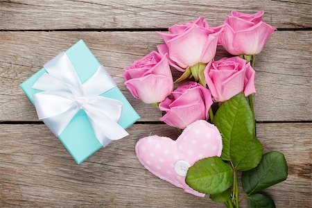 simsearch:400-08110734,k - Gift box, pink roses bouquet and handmaded heart toy over wooden table. Top view with copy space Stock Photo - Budget Royalty-Free & Subscription, Code: 400-08495342