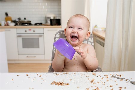 Little baby eating. Happy messy eater Stock Photo - Budget Royalty-Free & Subscription, Code: 400-08495364