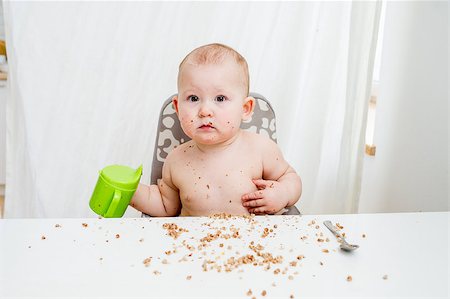 Little baby eating. Happy messy eater Stock Photo - Budget Royalty-Free & Subscription, Code: 400-08495361