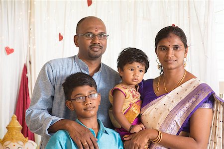 Indian parents and children in a blessing ceremony. Traditional India family portrait. Stock Photo - Budget Royalty-Free & Subscription, Code: 400-08495846