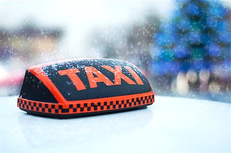 Taxi sign on a white car on a winter background Christmas tree Stockbilder - Microstock & Abonnement, Bildnummer: 400-08496508