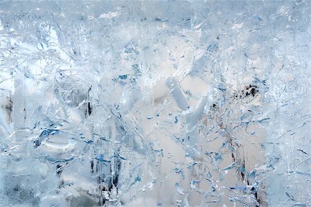 Glacial transparent block of ice (close up) with interesting drawings and patterns. Background. Foto de stock - Super Valor sin royalties y Suscripción, Código: 400-08497134