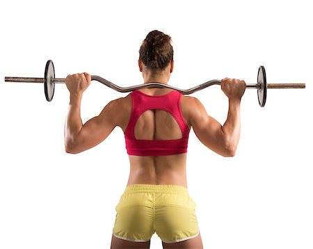 pic of girls with biceps - Muscular woman lifting an outrigger with weights Stock Photo - Budget Royalty-Free & Subscription, Code: 400-08497290