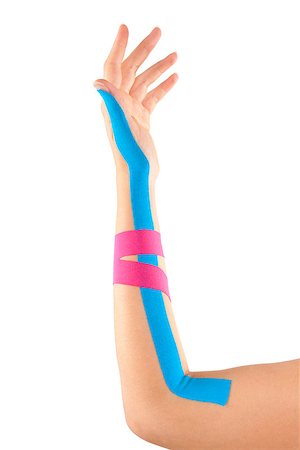 simsearch:400-08318516,k - Kinesio tape on female hand isolated on white background. Chronic pain, alternative medicine. Rehabilitation and physiotherapy. Stockbilder - Microstock & Abonnement, Bildnummer: 400-08497479