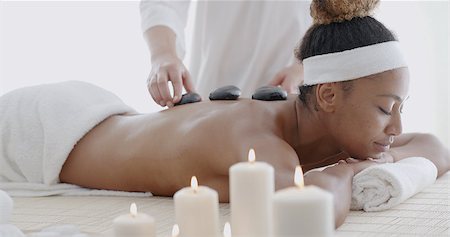 Young woman getting hot stone massage in spa salon Stock Photo - Budget Royalty-Free & Subscription, Code: 400-08497521