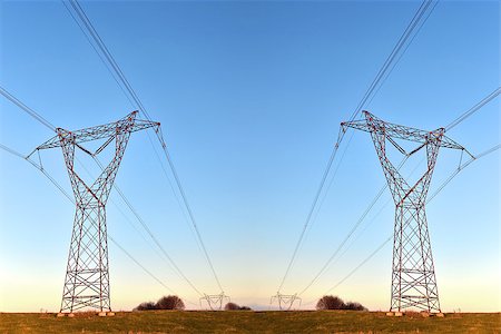 studio023 (artist) - pylons carrying high voltage electricity over long distances Stockbilder - Microstock & Abonnement, Bildnummer: 400-08497942
