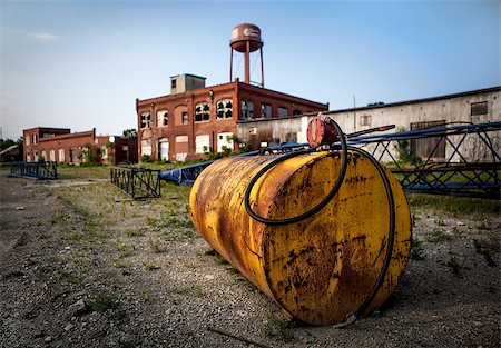 Old and Rusty Abandoned Oil Tank on Industrial Site Stock Photo - Budget Royalty-Free & Subscription, Code: 400-08498217