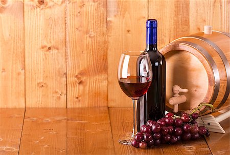 simsearch:400-08110621,k - Glass of red wine bottle barrel and grapes on  wooden background Stock Photo - Budget Royalty-Free & Subscription, Code: 400-08499847