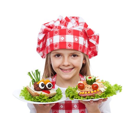 Happy little girl chef with creative sandwiches - isolated Stock Photo - Budget Royalty-Free & Subscription, Code: 400-08491662