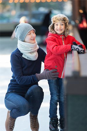 little boy and his mother ice skating together at outdoor skating rink, having winter vacation fun Stock Photo - Budget Royalty-Free & Subscription, Code: 400-08492547
