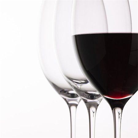 simsearch:400-08035611,k - Wineglass with red  wine on a white background Stock Photo - Budget Royalty-Free & Subscription, Code: 400-08492608