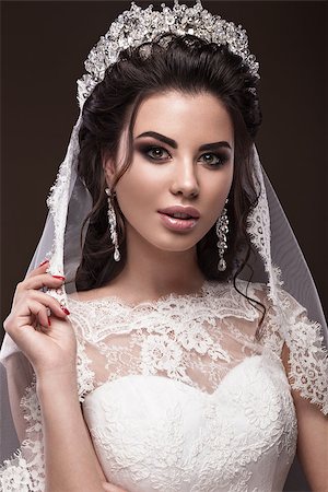 Beautiful brunette girl in the image of the Arab bride in a wedding dress and a crown on her head. Beauty face. Picture taken in the studio Photographie de stock - Aubaine LD & Abonnement, Code: 400-08492959