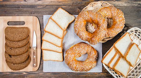 people eating bagels - Different types of bread on a wooden background Photographie de stock - Aubaine LD & Abonnement, Code: 400-08493135