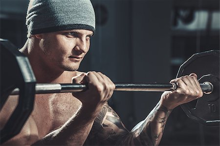 muscular male Bodybuilder posing in studio over black Foto de stock - Super Valor sin royalties y Suscripción, Código: 400-08493243