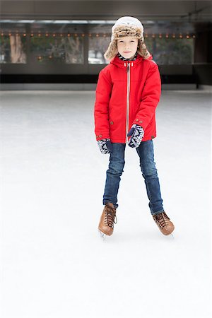 simsearch:400-08318063,k - positive smiling boy enjoying winter vacation at outdoor ice skating rink Photographie de stock - Aubaine LD & Abonnement, Code: 400-08493338