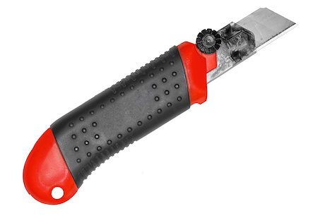 simsearch:625-01263851,k - Single red-black office cutter for paper. Isolated on white background. Close-up. Studio photography. Photographie de stock - Aubaine LD & Abonnement, Code: 400-08493593
