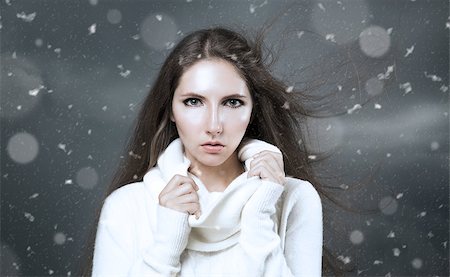 Outdoor Winter Portrait of Woman in White Cashmere Sweater. Dark Snow Storm Background. Stock Photo - Budget Royalty-Free & Subscription, Code: 400-08493963