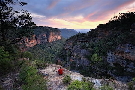 Sitting on  the edge of wilderness, Blue Mountains Katoomba, watching the last colours of sunset fade. Stock Photo - Budget Royalty-Free & Subscription, Code: 400-08504143