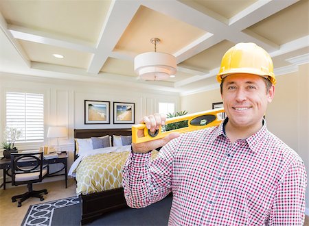 Smiling Contractor in Hard Hat with Level Over Custom Bedroom Drawing and Photo Combination. Stock Photo - Budget Royalty-Free & Subscription, Code: 400-08504972