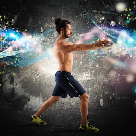 simsearch:400-04176322,k - Man fitness posture with light effects background Stock Photo - Budget Royalty-Free & Subscription, Code: 400-08505871