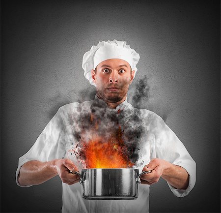 pan to the fire - Chef shocked holding a pot with flames Stock Photo - Budget Royalty-Free & Subscription, Code: 400-08506224
