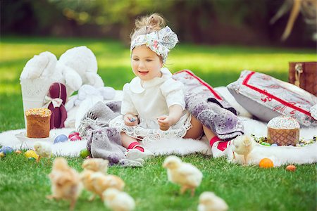Cute little smiling baby girl in park on green grass. Poster for Easter holiday. Selective focus on child Stock Photo - Budget Royalty-Free & Subscription, Code: 400-08506344