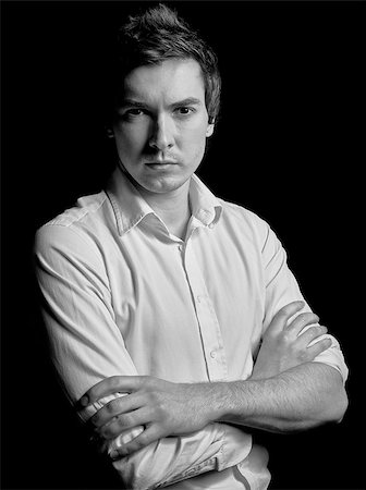 simsearch:400-06795988,k - Black and white portrait of a young businessman in a white shirt on a black background. Fashion model kind of guy. Foto de stock - Super Valor sin royalties y Suscripción, Código: 400-08506369