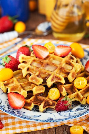simsearch:400-07917638,k - Belgian pumpkin waffles with fresh strawberry, kumquat, honey and cup of coffee Stock Photo - Budget Royalty-Free & Subscription, Code: 400-08506454