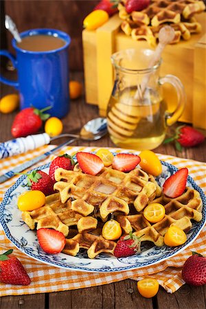 simsearch:400-07917638,k - Belgian pumpkin waffles with fresh strawberry, kumquat, honey and cup of coffee Stock Photo - Budget Royalty-Free & Subscription, Code: 400-08506453