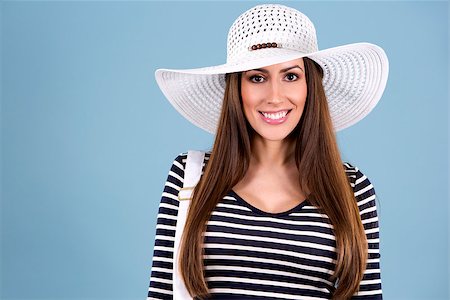 simsearch:400-07986693,k - young woman wearing dress and white hat on blue background Stock Photo - Budget Royalty-Free & Subscription, Code: 400-08507184