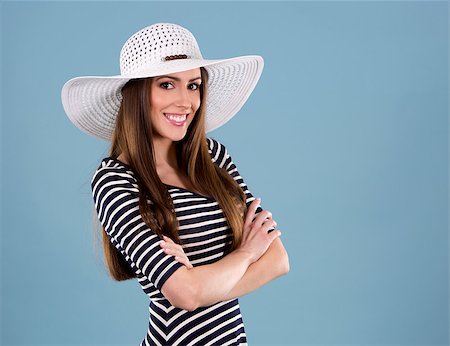simsearch:400-07986693,k - young woman wearing dress and white hat on blue background Stock Photo - Budget Royalty-Free & Subscription, Code: 400-08507185
