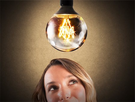 simsearch:640-01354128,k - Big light bulb shining over a businesswoman Photographie de stock - Aubaine LD & Abonnement, Code: 400-08507708