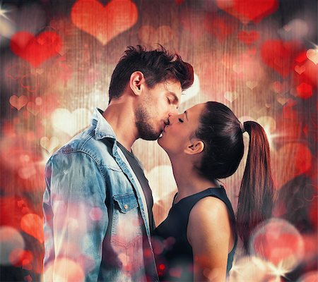 Girl and boy kissing with red hearts Photographie de stock - Aubaine LD & Abonnement, Code: 400-08500355