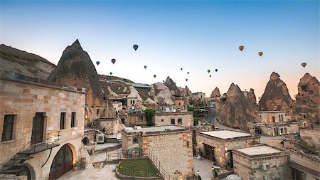 Hot air balloon flying over rock landscape at Cappadocia Turkey Photographie de stock - Aubaine LD & Abonnement, Code: 400-08500424