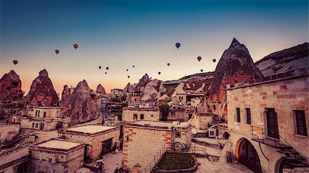 Hot air balloon flying over rock landscape at Cappadocia Turkey Photographie de stock - Aubaine LD & Abonnement, Code: 400-08500436