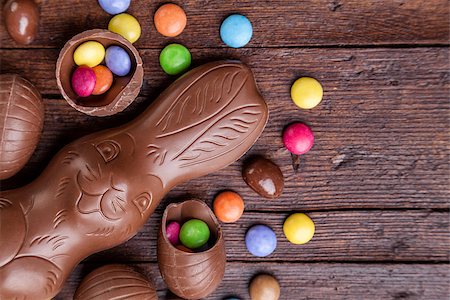Delicious chocolate easter eggs and sweets on wooden background Stock Photo - Budget Royalty-Free & Subscription, Code: 400-08501000