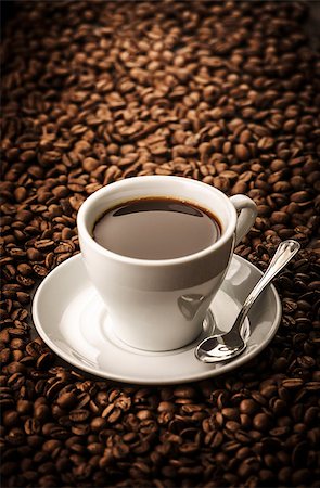 Black coffee on beans background with spoon Stock Photo - Budget Royalty-Free & Subscription, Code: 400-08501513